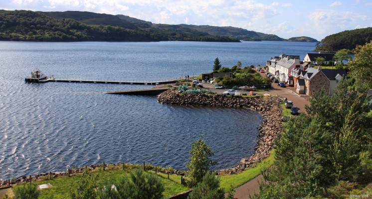 Shieldaig viewed from above
The village of Shieldaig was established in 1800 as a fishing community, grants were given by the admiralty to encourage people to move here and at the same time it built up a reserve of seamen for the Napoleonic war.  When that war ended there was enough of a living to be made out of fishing that people stayed.  Today the village is by-passed and can be easily missed but is well worth a minor detour.  [url=http://streetmap.co.uk/map.srf?X=181635&Y=853615&A=Y&Z=120] Map location. [/url]
