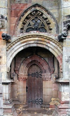 Side entrance at Rosslyn Chapel
Hardly any two stones seem to be the same colour in this picture of a side door at Rosslyn Chapel.  Constuction of the chapel was started in 1450.  [url=http://www.streetmap.co.uk/map.srf?X=327485&Y=663078&A=Y&Z=115/] Map location. [/url]
