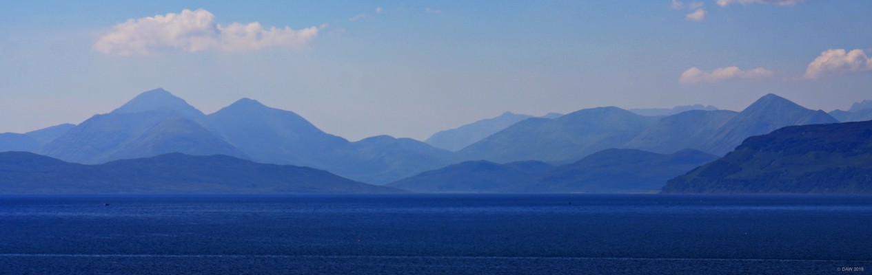 Skye from above Applecross
As you approach Applecross from the hills above you get spectacular view of the Islands of Skye and Raasay.  On this warm summer day the details of Skye are lost in a blue haze.  [url=https://streetmap.co.uk/map.srf?X=172997&Y=844971&A=Y&Z=115/] Map location. [/url]
