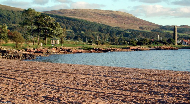Evening shadows at the South Beach, Largs. The Pencil Monument is on the right
