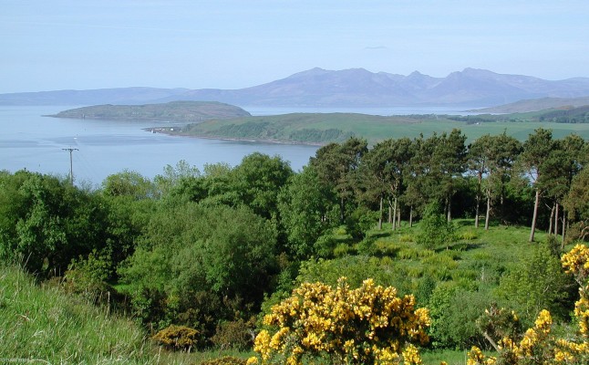 Spring time view over the Firth of Clyde
A view of the 4 biggest islands that lie in the Firth of Clyde.  In the foreground lies the Great Cumbrae, above and to the left is the Wee Cumbrae, in the distance  are the mountains of the Isle of Arran and just below to the right is the tail end of the Island of Bute.
