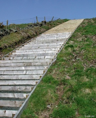 Stairway to Heaven?
Disapointingly this stairway doesn't quite reach Heaven, but it does take you up to a higher leel in part of the Fereneze Pathway network that lets you walk all the way from Killoch Glen over the top of the Fereneze Hills to Paisley.  [url=http://www.streetmap.co.uk/streetmap.dll?G2M?X=248160&Y=658645&A=Y&Z=3/]Map location[/url]
