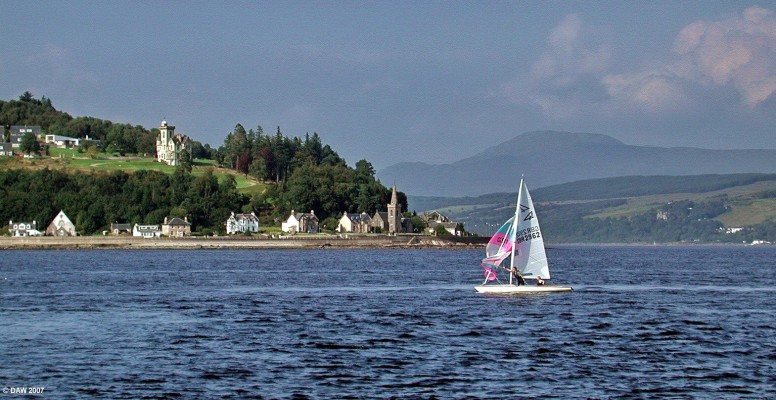 Strone Point, Firth of Clyde
As seen from the ferry just after it has left Hunter's Key.  The mouth of the Holy Loch is on this side of Strone Point and the entrance to Loch Long is on the other side.  The steepls of Strone Church can be seen on the shore line.  [url=http://www.multimap.com/map/browse.cgi?lat=55.9716&lon=-4.9005&scale=50000&icon=x/]Map location[/url]
