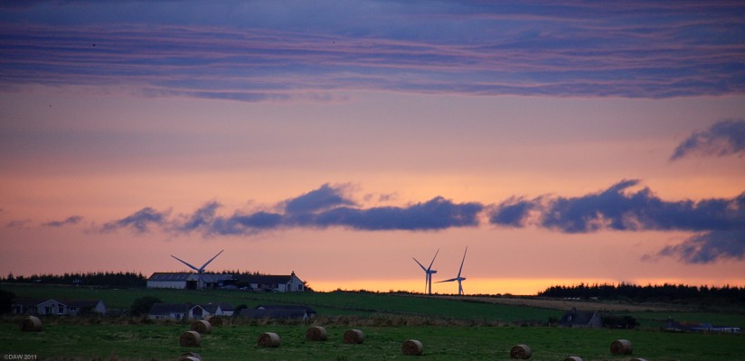 Sunset from near Wick Castle
Looking West from old Wick Castle, the 3 Turbines of of Bilbster Wind farm can be seen in the distance.  [url=http://www.streetmap.co.uk/map.srf?X=336950&Y=948699&A=Y&Z=115/] Map location. [/url]
