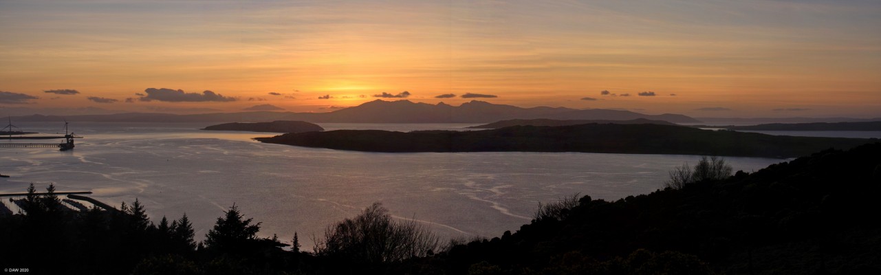 Sunset over Arran
The sun has just set behind the Island of Arran, in from of Arran is, Bute, the Wee Cumbrae and the Great Cumbrae.  On the left is the Hunterston Ore Terminal, taken in 2016 before the cranes were removed.
