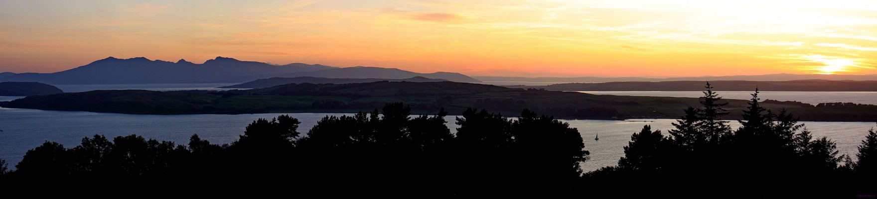 Sunset over Bute from above Largs
The Great Cumbrae is in the foreground, the Isle of Bute is behind on the right and the Isle of Arran on the left.  [url=http://www.streetmap.co.uk/map.srf?X=221428&Y=658536&A=Y&Z=120/] Map location. [/url]
