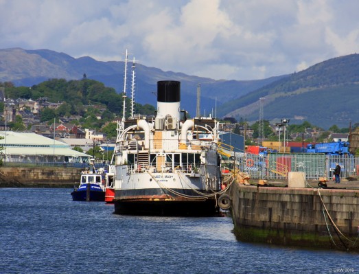 TS Queen Mary, Garvel dock, Greenock
The Queen Mary on her return to Scotland looking a little worse of the wear.  She is moored here awaiting restoration work to be carried out.  The hills seen in the back ground are on the other side of the River Clyde around the Holy Loch..
