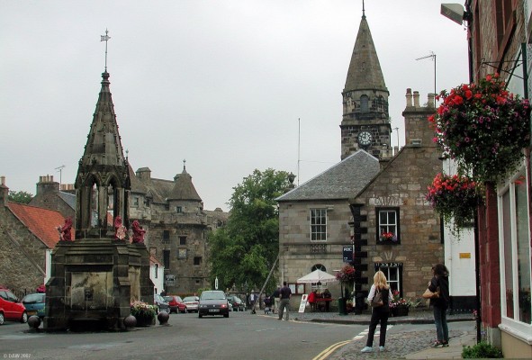 The Market Square, Falkland
The small village of Falkland is dominated by Falkland Palace which dates from the early 1300s.  The Palace can be seen behind and to the right of the Bruce fountain in the market square. [url=http://www.multimap.com/map/browse.cgi?lat=56.2532&lon=-3.2053&scale=25000&icon=x/]Map location[/url]

