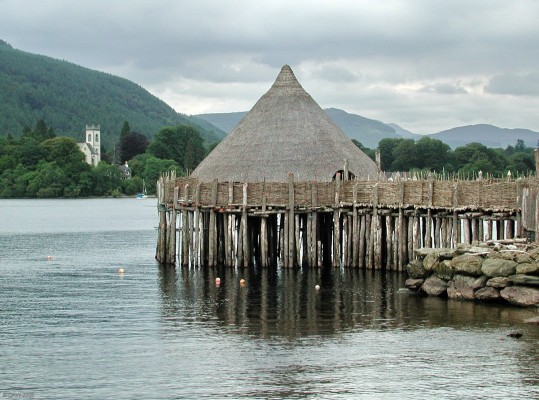 The Crannog Centre, Loch Tay
[url=http://www.crannog.co.uk/]The Scottish Crannog Centre[/url] is at the Kenmore end of Loch Tay and is an authentic reconstruction of a form of dwelling dating from 5,000 years ago.  Loch Tay itself has the underwater remains of 18 such structures.  The Church at Kenmore is in the background.  [url=http://www.streetmap.co.uk/streetmap.dll?G2M?X=277040&Y=744875&A=Y&Z=3/]Map location[/url]
