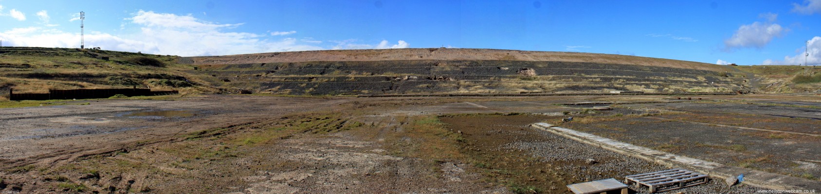 Inside the dry dock, Hunterston Construction yard
Its difficult to get an idea of the scale of this hole in the ground from a photo.  Where I am standing is about 12m below sea level.  The top part of the bank that is sand is  removed to allow structures to float in or out of the dock.  Its more than 10 years since anything has been built here and its future use is uncertain other than as a test area for offshore wind turbines.
