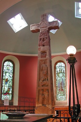 The Ruthwell Cross
Carved in the early 8th century at a time when Ruthwell lay within the Kingdom of Northumbria.  It was a symbol of power of the Church of Rome in an area where the Celtic Church had previously been dominant.  Today the cross stands inside the Parish Church at Ruthwell, in 1833 the Rev Henry Duncan did the first accurate drawings of the cross and translated the runic inscriptions which confirmed its remarkable survival.

