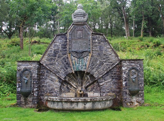 The Tweedmouth Memorial Fountain, Tomich
Built in memory of the 1st Lord of Tweedmouth and his wife who lived nearby in Guisachan House.  Sir Dudley Coutts Marjoribanks is credited with creating the Golden Retriever dog through selective breeding.  You can see a dogs head below both of the engraved heads on either side of the well.  [url=http://streetmap.co.uk/map.srf?X=230582&Y=827199&A=Y&Z=115/] Map location. [/url]
