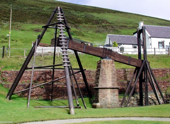 The Wanlockhead Beam Engine
This unique beam engine probably dates from the early 19th century.  It was designed to pump water from the working of  the 'Margaret' or 'Straightsep' vien of lead ore that runs below this spot.  A bucket on the right continually filled and emptied raising and lowering the pivot, at the other end was a pump rod which raised water from the mine up the open shaft.  [url=http://www.streetmap.co.uk/streetmap.dll?G2M?X=286930&Y=613095&A=Y&Z=3/]Map location.[/url]
