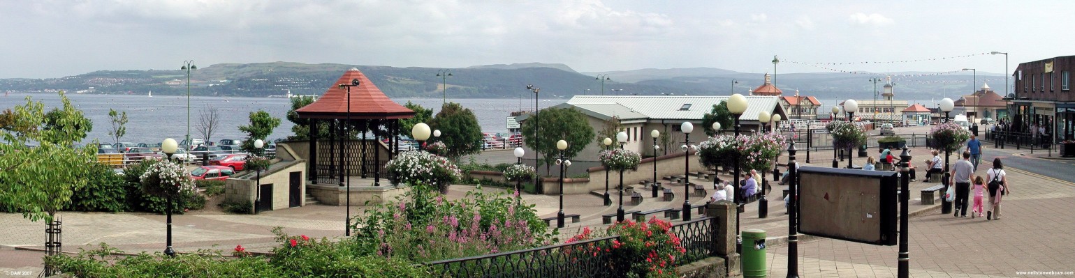 The Bandstand, Dunoon
Located near the sea front at the start of Argyll Street.  On the right the red tiled roofs of the pier buildings can be seen in the distance.  To the left of the bandstand roof you can see Cloch Lighthouse on the opposite side of the Clyde.  [url=http://www.multimap.com/map/browse.cgi?lat=55.948&lon=-4.924&scale=10000&icon=x/]Map location[/url]
