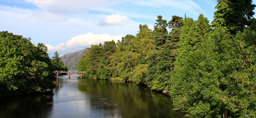 The old Oich bridge, Fort Augustus
The wooden trestle bridge you see in the distance here was constructed as a 'temporary' replacement to a stone bridge that what destroyed in a great flood on 1849.  The replacement stone bridge was completed by 1850 and is where this photo is taken from.  After 160 years the temporary bridge is still standing, if only just. [url=http://www.streetmap.co.uk/map.srf?X=237898&Y=809187&A=Y&Z=106&ax=237895&ay=809273/] Map location. [/url]
