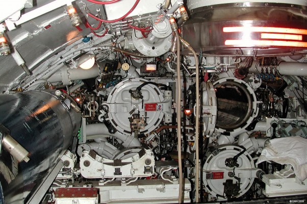 Torpedo room, HMS Ocelot
The somewhat cramped conditions in the Torpedo room of the Oberon class submarine, HMS Ocelot.  Ocelot was based at Faslane on the Clyde between 1964 and 1991.  The escape hatch can be seen at the top right with the reflective strips.
