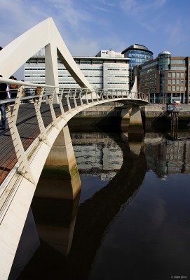 The tradeston footbride, Glasgow
Known in Glasgow as the squiggly bridge, due to its curve. It was given a curve to give greater length so that the incline isn't as steep as would have been required for a straight bridge, allegedly.  The bridge was opened in 2009 giving a link from the so called 'financial district' to Tradeston, I'm sure the good people of Tradeston feel all the better for it.
