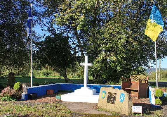 The Ukranian Memorial, Hallmuir, near Lockerbie
In 1947 450 Ukranian Prisoners of War were transferred from Italy to start a new life in Scotland.  If they had been returned to Stalinist Russia their future would have been uncertain.  They were housed in an empty POW camp here at Hallmuir.  Many ended up working on local farms and staying in the area.  All that remains is the hut that they made into a Ukranian style Chapel and this memorial.  [url=http://www.streetmap.co.uk/map.srf?X=312895&Y=579220&A=Y&Z=120/] Map location. [/url]
