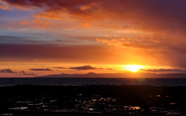 Sunset at Seamill
A winter sunset from the shore at Seamill.  The sun is setting over the island of Arran. [url=http://streetmap.co.uk/map.srf?X=220826&Y=645951&A=Y&Z=120/] Map location. [/url]
