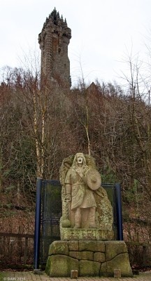 "Freedom" Statue and the Wallace Monument
Installed in the car park of the Wallace Monument visitor centre in 1997, it was  described as, "among the most loathed pieces of public art in Scotland" by a newspaper, and as "a lump of crap" by a more astute local.  The sculptor, Tom Church, was inspired by the film Braveheart.  Due to expansion of the visitor centre it has since been removed and now resides at the sculptors home since nobody, even in North America, seemed prepared to pay his asking price of �350,000.
