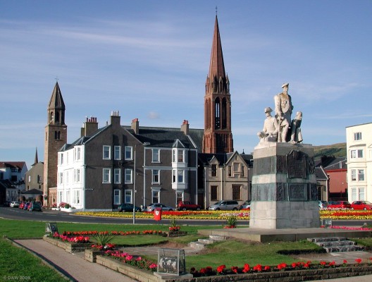 The War Memorial, Largs seafront
The red sandstone steeple of The Clarke Memorial Church is behind and the smaller steeple of St John's Church is to the left.
