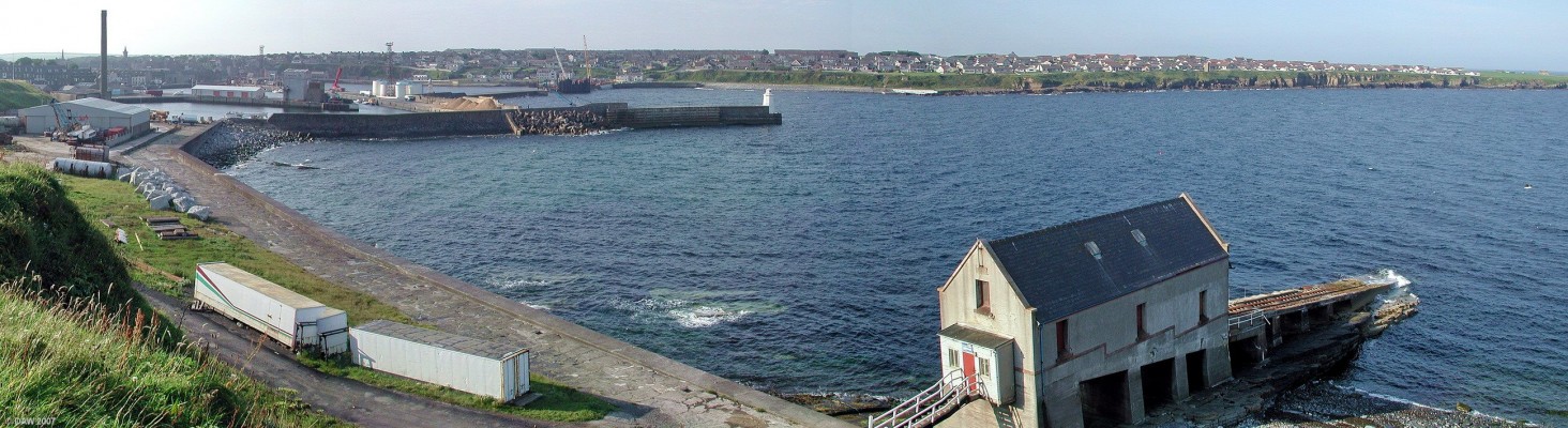 Over looking Wick Harbour, Caithness
A safe haven for boats since 1803.  The fishing trade at Wick peaked around 1900 with 1120 vessels based here.  Today the port is mainly used for receiving and exporting varies types of goods including oil related cargo and Wind Turbines.  The old lifeboat station is on the right, there is now a modern lifeboat moored within the harbour. [url=www.multimap.com/map/browse.cgi?lat=58.4367&lon=-3.0797&scale=25000&icon=x/]Map location[/url]
