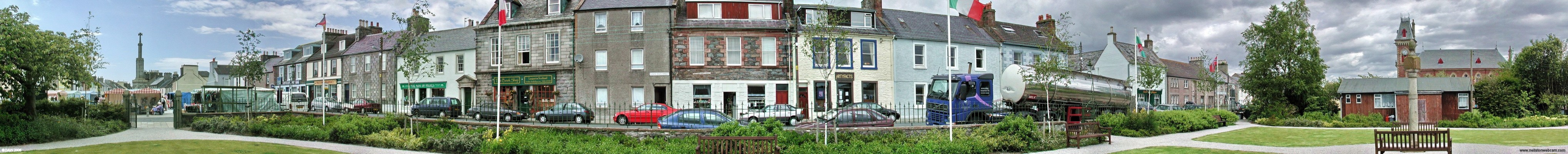 Wigtown, Scotland's National Book town
A panoramaic view on market day down one side of the town square in Wigton.  The war memorial is on the left and the old County Building is on the right.  After a period of decline Wigtown 're-invented' itself under the banner of [url=http://www.wigtown-booktown.co.uk/]Book Town [/url] which means it now has a host of flourishing shops that attracts visitors throughout the year. [url=http://www.streetmap.co.uk/streetmap.dll?G2M?X=243342&Y=555340&A=Y&Z=1/]Map location. [/url]
