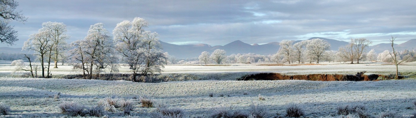 A winter view from near Drymen Bridge
A hard frost has made everything white in this view from near where the Drymen Bridge cross Endrick Water.  The hills of the Trossochs can be seen in the distance.  [url=http://www.streetmap.co.uk/map.srf?X=235905&Y=698677&A=Y&Z=120/] Map location. [/url]
