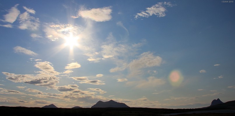 Big sky, Ross & Cromarty
The peaks north of Ullapool silhouetted from a distance.  Suilven is on the right, Cul Mor in the centre and probably Cul Beag on the left.  [url=http://www.streetmap.co.uk/map.srf?X=227146&Y=910242&A=Y&Z=115/] Map location. [/url]

