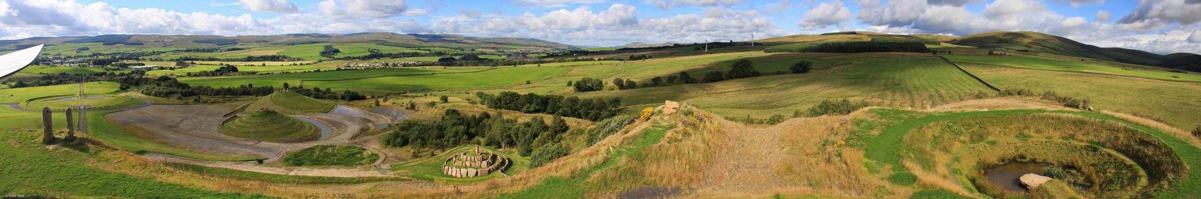 The Crawick Multiverse
The Crawick Multiverse is a conceptual representation of the Universe in the landscape.  On the left is the Sun Amphitheatre, the large gassy mounds represent our own galaxy and that of Andromeda, the lumpy bit in front represents a Galactic supercluster (of Galaxies) and the hole with water on the right, not sure, maybe a black hole!  I'm sure that thousands of years from now, academics will ponder over its origins.
