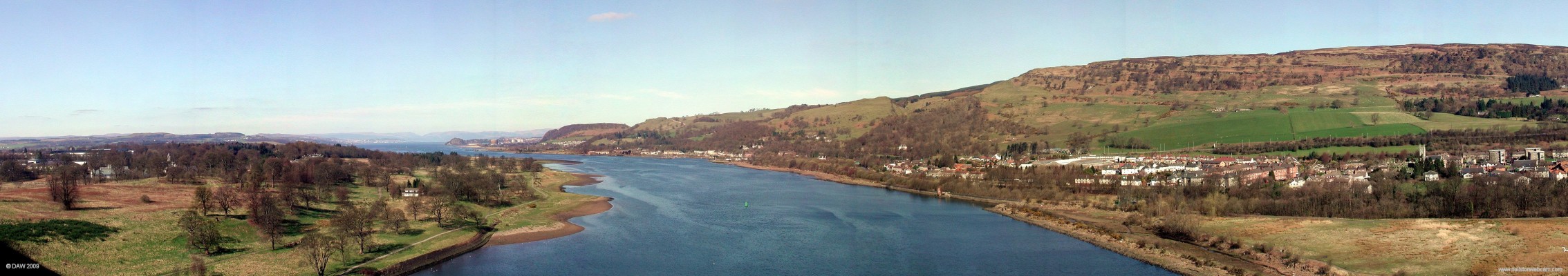 Panoramic view from centre of Erskine Bridge
Looking west from the centre of the 1000ft span of the Erskine bridge.  At this point you are about 180ft above the river giving a commanding view down the Clyde.  On the left are the grounds of Erskine Hospital, in the distance you can see Dumbarton and Greenock and on the right is Old Kilpatrick.  [url=http://www.streetmap.co.uk/map.srf?X=246165&Y=672472&A=Y&Z=120/] Map location. [/url]
