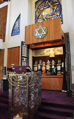 Inside Giffnock Synagogue, Glasgow
A view of the Ark in Giffnock Synagogue. It contains the Torah scrolls which are the 5 books of Moses, all written by hand on parchment.  The pulpit in front of the ark is for delivering 'Enlightening sermons' by the Rabbi or visiting dignitaries.
