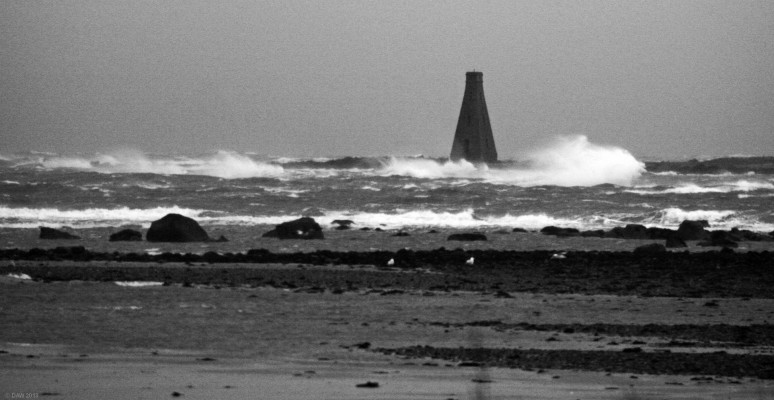 Horse Island, Ardrossan
Horse Island as seen from the shore near Ardrossan on a stormy day.  The island is only 1km from the shore and only rises about 4m.  Several ships have floundered on it due to its proximity to the entrance to Ardrossan Harbour.  The tower was built in 1811 as a marker and also as a refuge for anyone unfortunate enough to find themselves on the rocks in a storm.  [url=http://www.streetmap.co.uk/map.srf?X=222065&Y=644130&A=Y&Z=120/] Map location. [/url]
