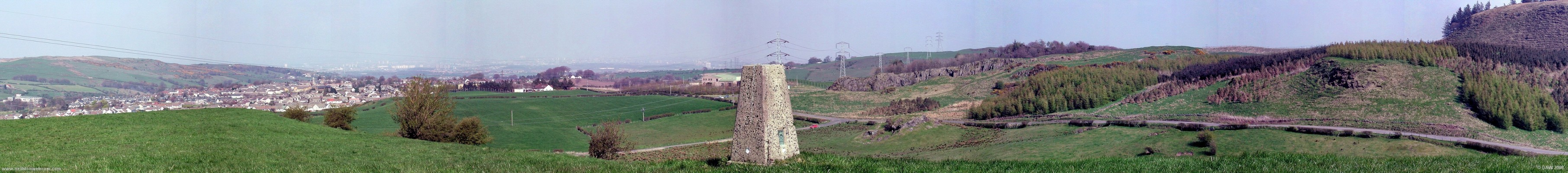 Panorama from Trig point above Kilburn Farm
On the extreme left Crofthead mill and Neilston.  Just to the right of the trig point is the old Neilston Quarry and on the extreme right is the start of the Neilston Pad.  Glasgow can just about be made out in the haze in the distance.
[url=http://www.streetmap.co.uk/streetmap.dll?G2M?X=246985&Y=655755&A=Y&Z=3/]Map location[/url]
