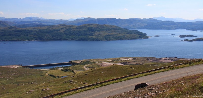 Loch Kishorn
A view of Loch Kishorn and the Kishorn Oil construction yard.  Built in 1975 to support North see oil construction the 600,000 ton concrete Ninian central platform was built here.  At its peak the yard employed 3000 workers who mostly  lived in accommodation on site.  The yard closed in 1987 but there are now plans to put it to use again for the construction of off shore wind turbines. [url=https://streetmap.co.uk/map.srf?X=180803&Y=840503&A=Y&Z=120/] Map location. [/url]
