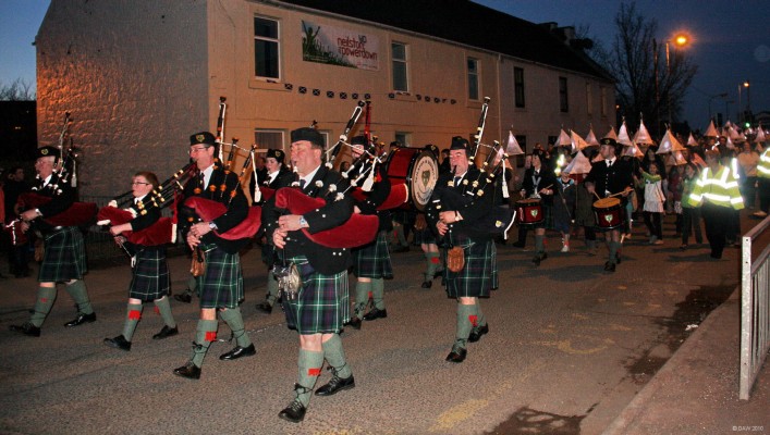 Lantern Parade, Neilston Power Down, 2010
The Neilston & District Pipes and Drums leads the lantern parade around the village at the close of the Neilston Powerdown event in March 2010. 
