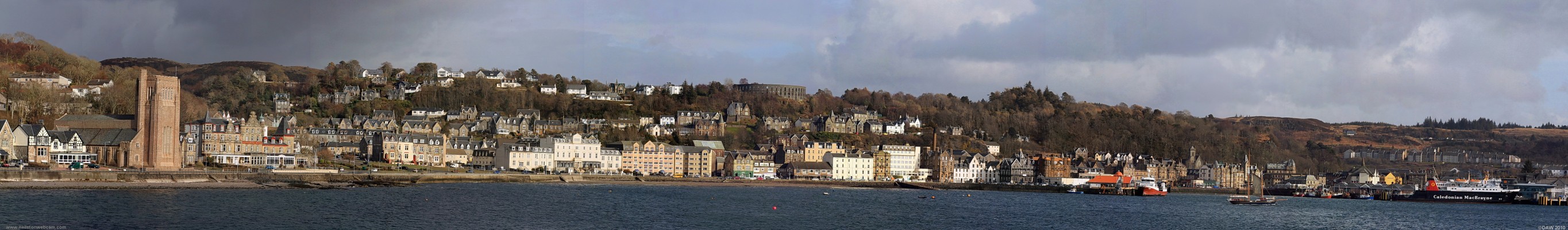 Oban from Oban Bay
On the left is St Columbas Cathedral, in the centre on top of the hill is McCaigs Folly, to the right and below is the old pier and on the extreme right is the modern pier with the Calmac ferry, Lord of the Isles, berthed.  [url=http://www.streetmap.co.uk/map.srf?X=185207&Y=730310&A=Y&Z=120/] Map location. [/url]
