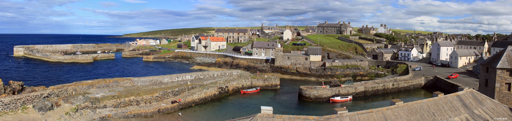 Portsoy Harbour area
A view of the two harbours at Portsoy.  On the right is the old harbour which dates from the 17th century and is the oldest on the Moray Firth.  On the left in the background is the "new" harbour which dates from 1825, it was built for the herring fleet which at its peak was a fleet of 57 boats. [url=http://streetmap.co.uk/map.srf?X=358863&Y=866404&A=Y&Z=115/] Map location. [/url]
