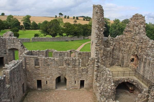 Tolquhon Castle, Aberdeenshire
A view from the highest remaining building towards the main gate at Tolquhon Castle.  The castle was built quickly between 1584 and 1589 and incorporated as earlier 15th century tower.  It was more of a palatial residence than a defensive structure.  The gunloops are for display, their shape and size preventing their effective use.
