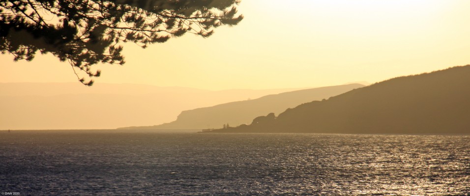 Shades of red, Largs
Looking out from Largs sea front.  The first island is the great Cumbrae with the outline of the Lion Rock, behind that is the Wee Cumbrae, behind that is Bute and almost lost in the haze is the Island of Arran.  [url=http://streetmap.co.uk/map.srf?X=220097&Y=659498&A=Y&Z=110/] Map location. [/url]
