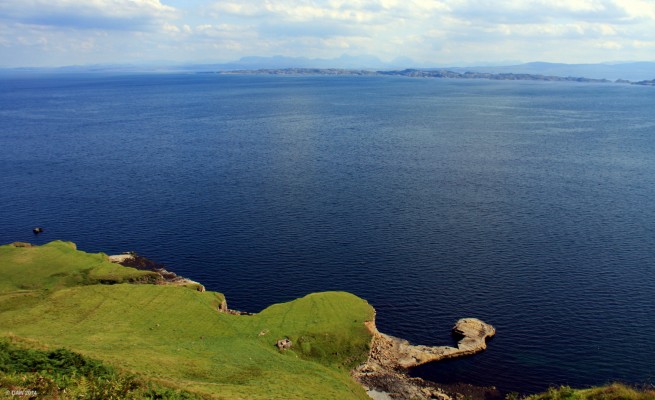 Leac Tressirnish, Isle of Skye
A natural rock formation creating a harbour on the east coast of Skye.  The closest land that can be seen is the Island of Rona.  Just to the left of Rona you can just about make out a light coloured area on the mainland that are the sandy beaches at Redpoint, near Gairloch.  In the distance in the centre are the Torridon Mountains. [url=http://streetmap.co.uk/map.srf?X=152059&Y=857749&A=Y&Z=120/] Map location. [/url]

