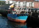 Fishing_boat_at_old_Largs_pier.jpg