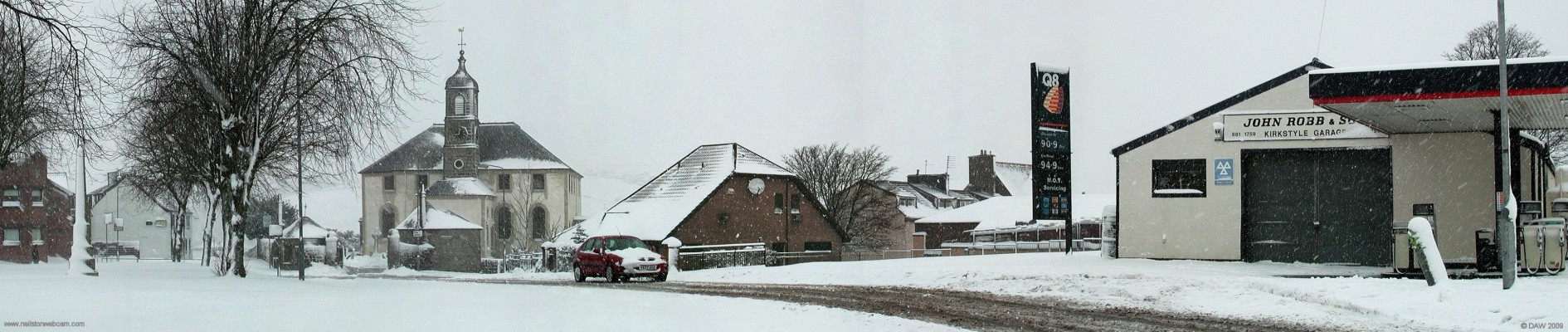 Blizzard in High Street, Neilston
OK so its not really a blizzard but even for Neilston this is a lot of snow.  Taken in March 2006.  The Robertson Memorial is on the left and the Health Centre is the building to the right of the Church.  [url=http://www.streetmap.co.uk/map.srf?X=248047&Y=657241&A=Y&Z=110/] Map location. [/url]
