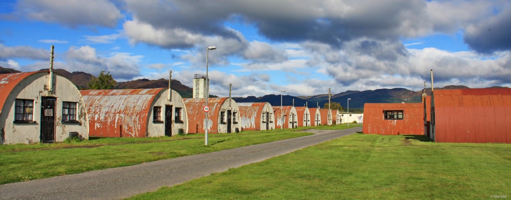 Cultybraggan Camp, 2018
The former Prisoner of War camp near Comrie.  Built in 1941 as a high secrity PoW camp, it has survived as it was later used as a terrotorial army training camp. Since 2004 it has been owned by the Comrie Development trust, many of the original building are now listed.  Since this photo was taken the huts on the left have been restored and converted into holiday lets.  [url=http://streetmap.co.uk/map?X=276947&Y=719833&A=Y&Z=115/] Map location. [/url]
