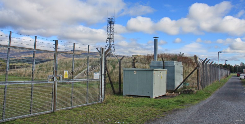 Cultybraggan former RGHQ bunker
Built in the late 1980s at a cost of £30m it was intended to replace the bunker at Troywood (now a museum) but although completed in 1990 it was never used.  It was not designed to withstand a direct hit but rather protect those inside from the fall out of a Nuclear detonation.  You can see an emergency exit on the side.  Today the bunker is used by an Internet provider.  [url=http://streetmap.co.uk/map?X=276875&Y=720166&A=Y&Z=115/] Map location [/url]
