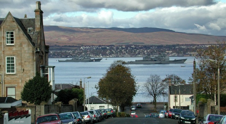 US Navy warships anchored off Greenock
Its not a particularly common sight to see so many foreign warships anchored on the Greenock side of the river Clyde.  This was taken in October 2004 which is around the time navel excercises often take place off the west coast of Scotland.  The vessel on the right is the Ticonderoga class Guided missile Cruiser USS Anzio (CG68) and the one on the left is as an unknown Alreigh Burke Class Destroyer.
