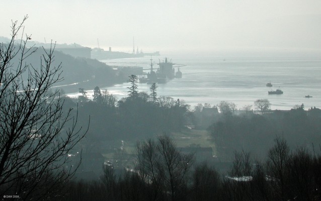 Faslane Fuel Depot
Taken in 2003 from the Whisltefield viewpoint..  The large ship is probably one of the old 'leaf' class oilers with a couple of visting Frigates moored in front.  [url=http://www.streetmap.co.uk/map.srf?X=223707&Y=692078&A=Y&Z=120/] Map loation. [/url]
