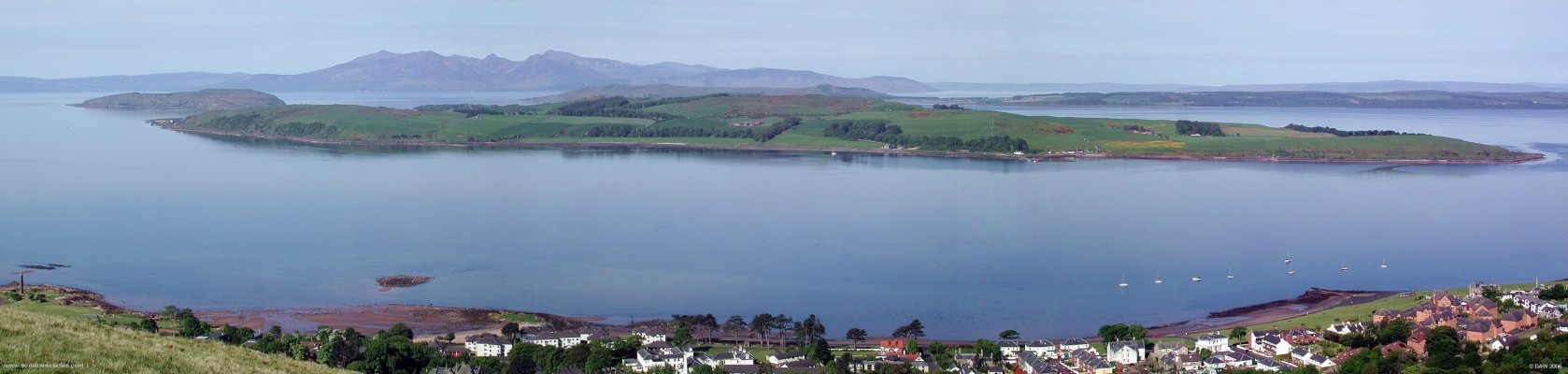 Great Cumbrae and Arran panorama, Firth of Clyde
A peaceful Sunday morning view over the firth of Clyde from the top of Douglas Park in Largs.   The great Cumbrae is the closest (population 1400), to the left  is the Wee Cumbrae (population less than 10),  in the distance is the Isle of Arran (Population around 5000) and to the right is the Island of Bute with a population of around 7100.
