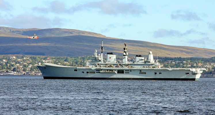 HMS Ark Royal anchored on the Clyde, 2008
Ark Royal was the last of the 3 Invincible class Aircraft carriers to be built for the Royal Navy.  She was built at Swan Hunter on the Tyne and commissioned in 1985.  Depending on her role she would embark a mix of Harrier GR7/9 jets, Merlin and Sea King helicopters.  As of early 2011 she is being decomissioned which only leaves her older sister ship, HMS Illustrious in still in services, but with no jets.  She is pictured here during the Joint Warrier exercise in October 2009.
