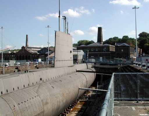 HMS Ocelot, Chatham Historic Dock, 2003
Pictured here at the Chatham historic Dockyard Museum in the south of England.  She was launched at Chatham in 1962 and entered service in the 3rd Flotilla based at Faslane on the Clyde where she served until 1991.  Ocelot was a diesel electric boat capable of up 17 knots submerged.  The RN no longer operates diesel submarines, the Upholder class which was to replace the old Oberons were all sold off to the Canadian navy leaving the RN with an all nuclear submarine fleet.
